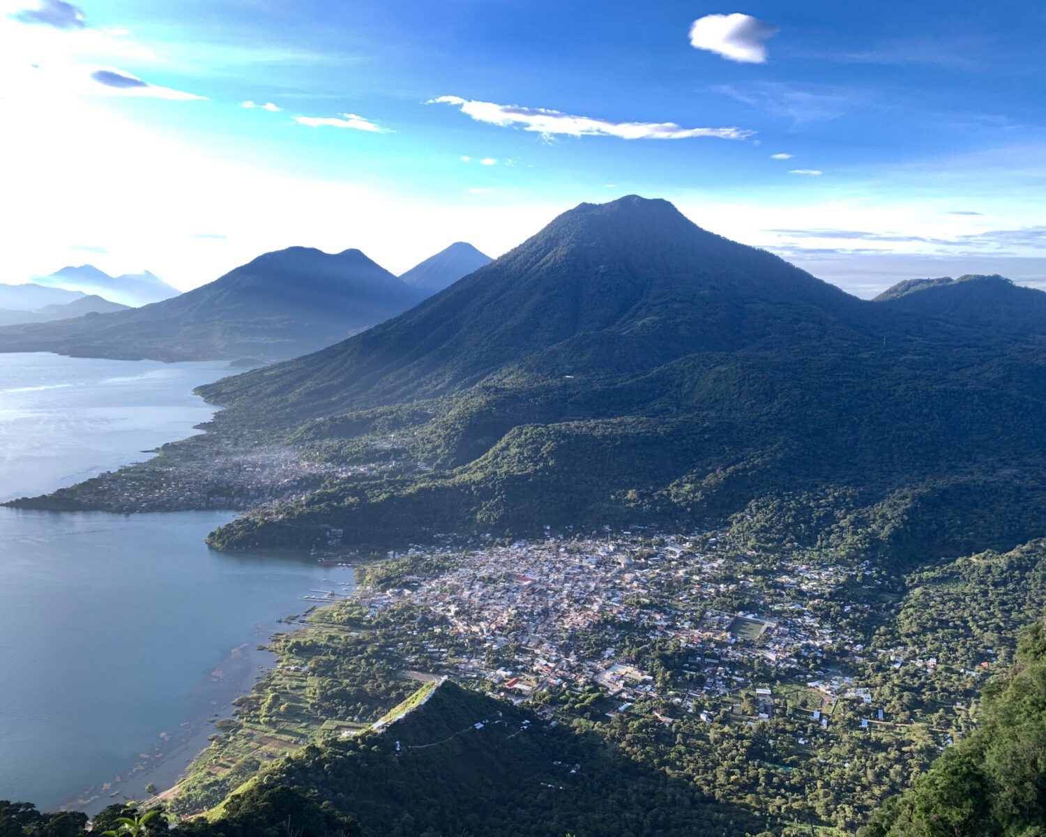Photo of village with volcanoes background on lake atitlan